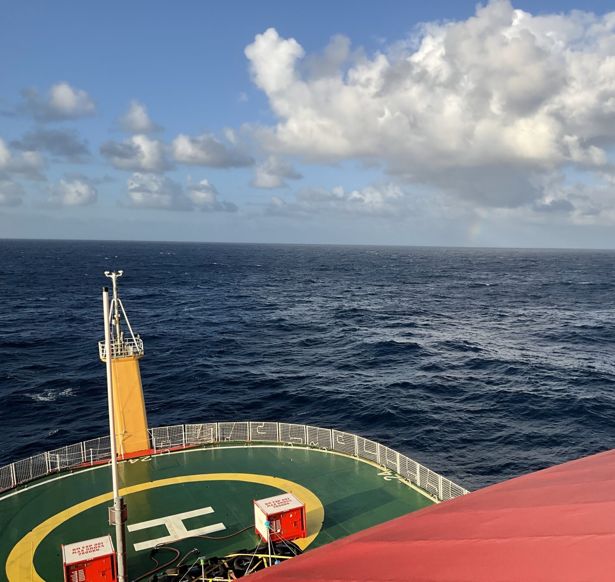 A view from a top deck of the ship, looking out over the helideck