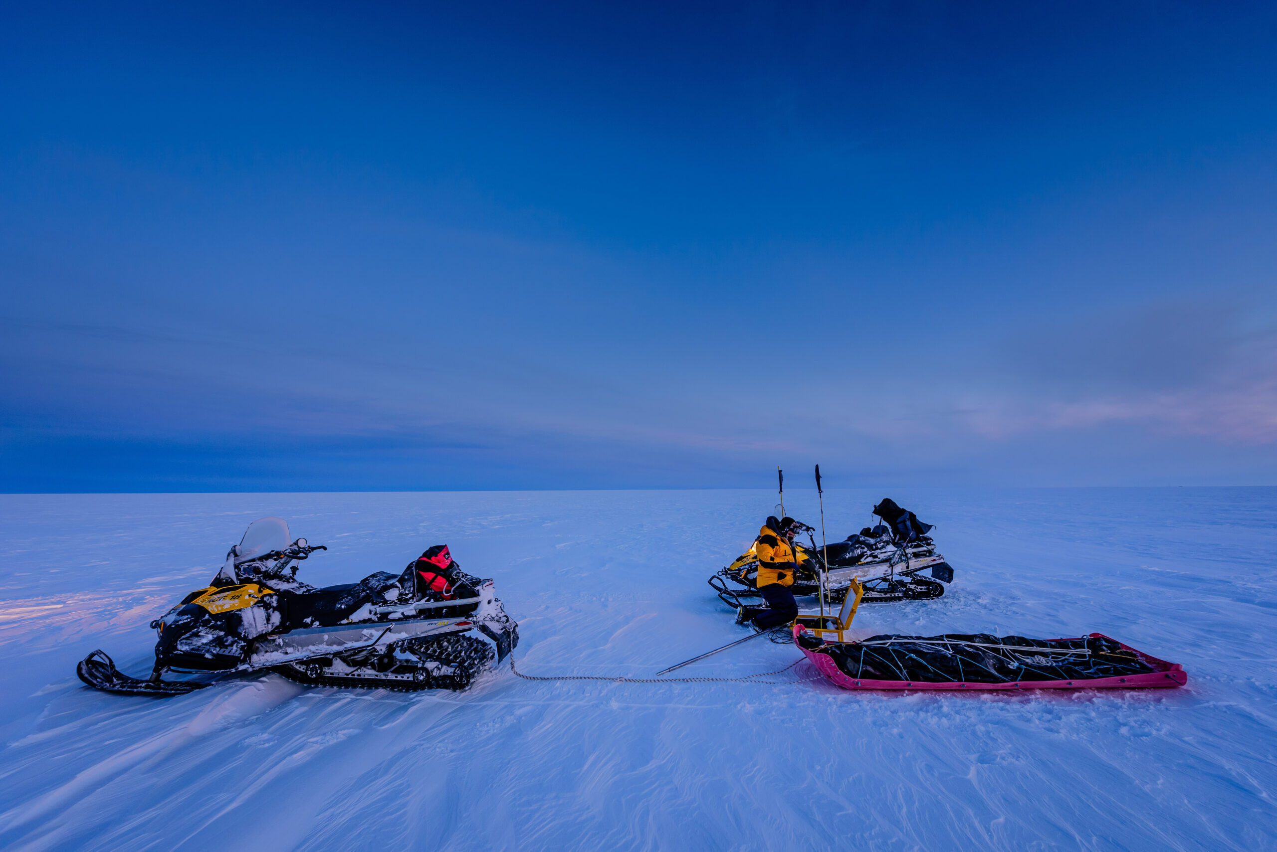Two skidoos and a sledge