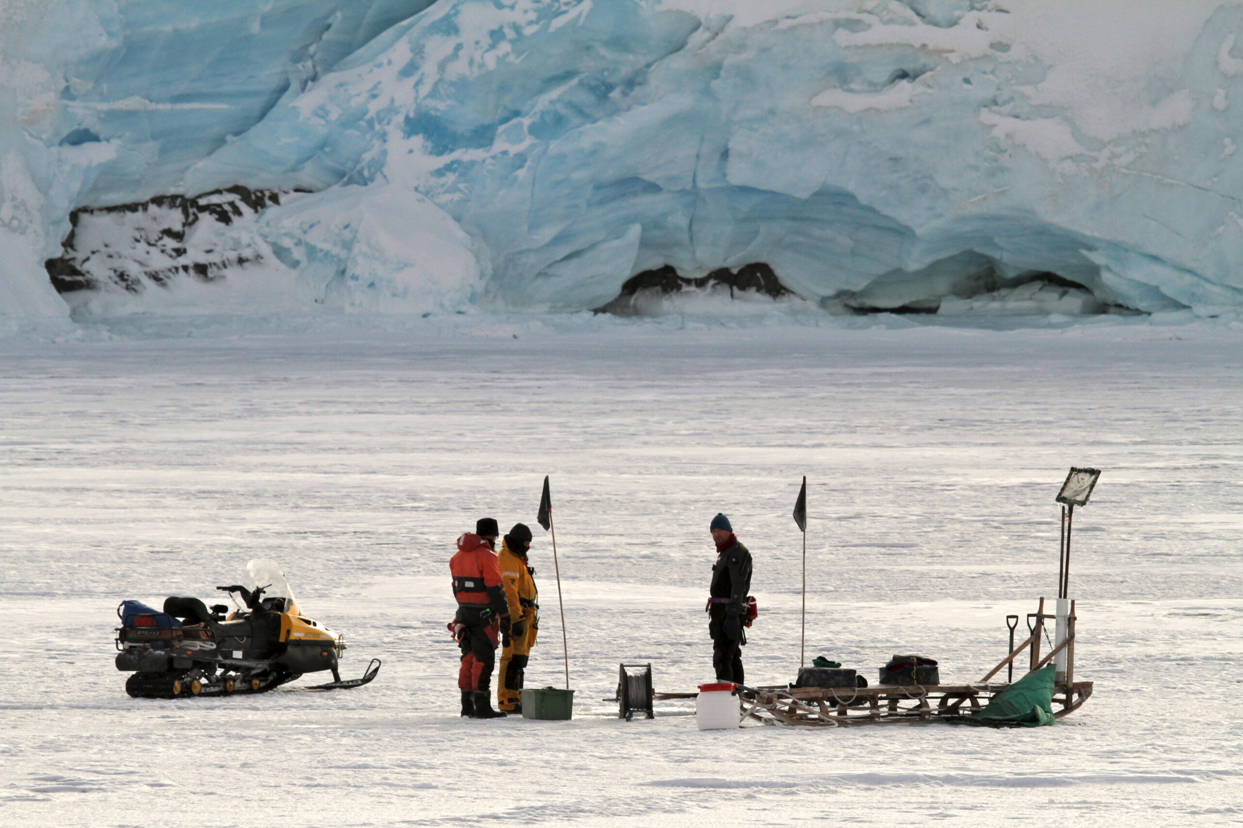 A group of scientists in a snowy landscape