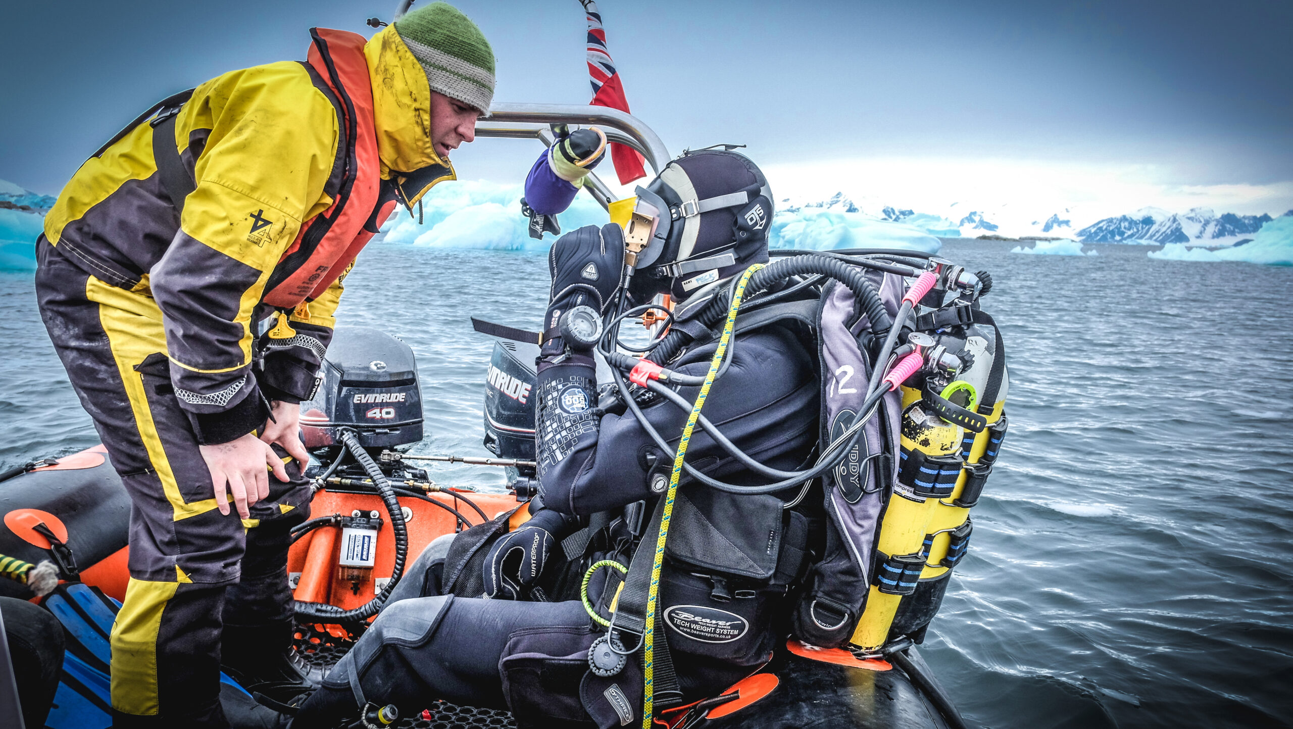 A person in scuba gear gets ready to dive