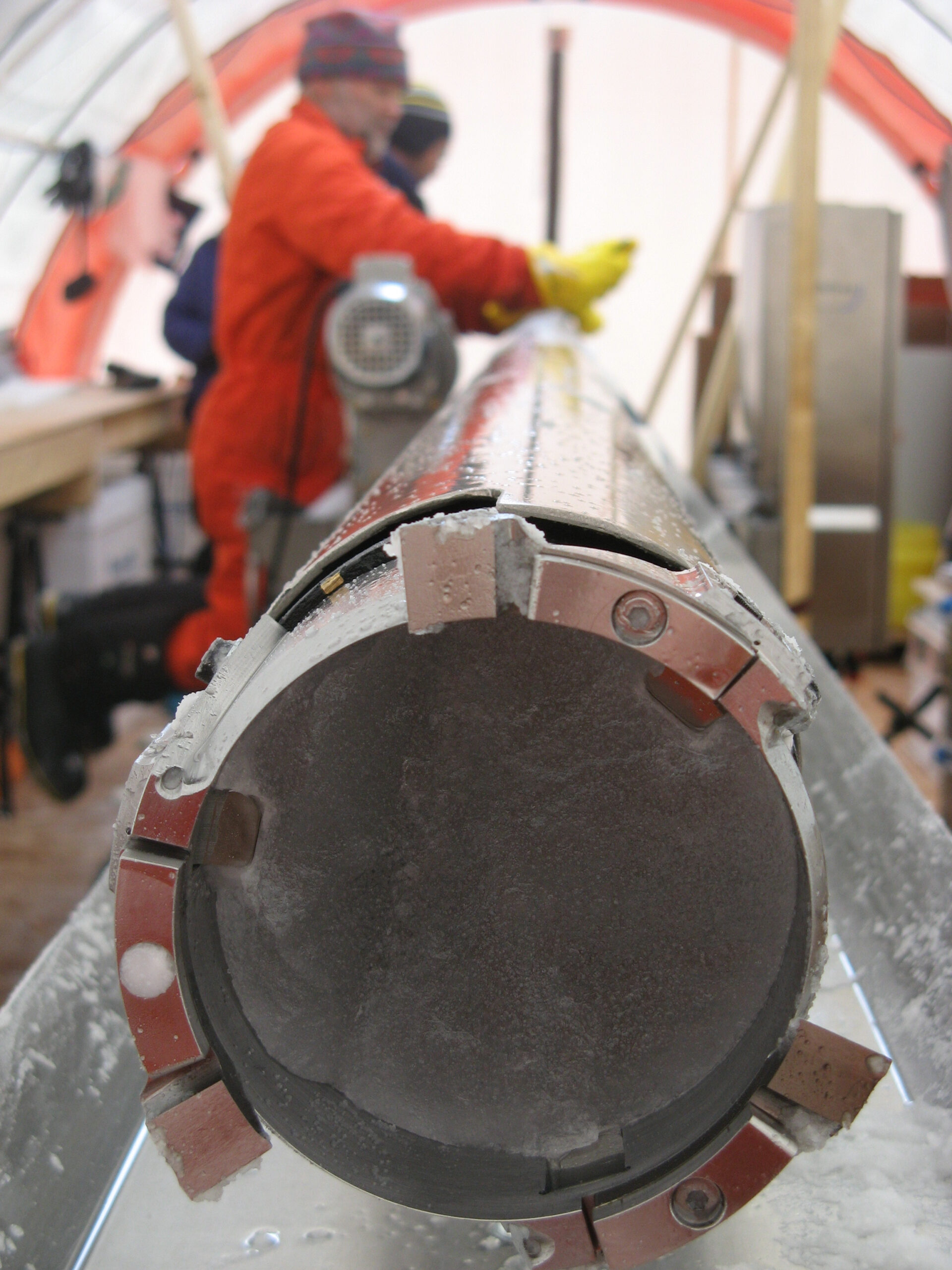 A cross-section of a cylinder of ice in a long metal tube.